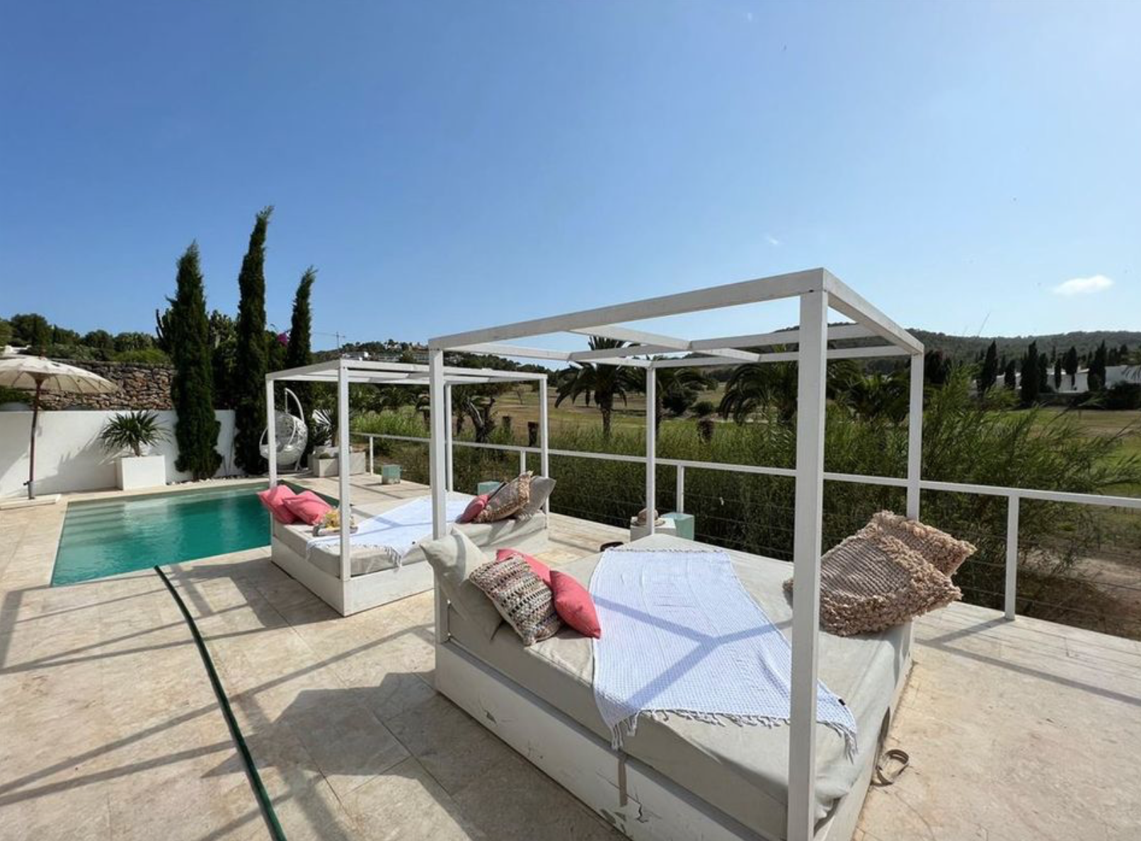 resa estates for sale roca llisa private pool frontal views pool daybeds.png